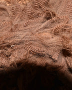 Close-up of undyed brown alpaca fleece from our own herd at Mulgoa, western Sydney, showing the crimp before it is washed or carded.