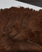 Raw brown alpaca staples showing the crimp along each lock. Grown on our own herd at Mulgoa and supplied unwashed.
